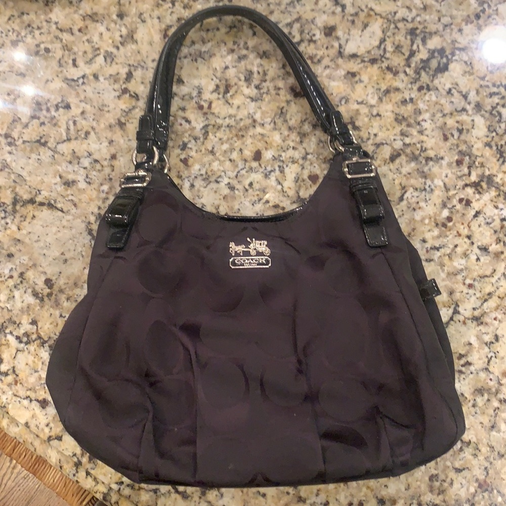 Coach Black signature canvas purse. With red interior and silver carriage emblem